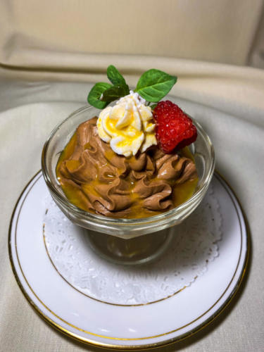 Chocolate mousse with whipped cream and berries